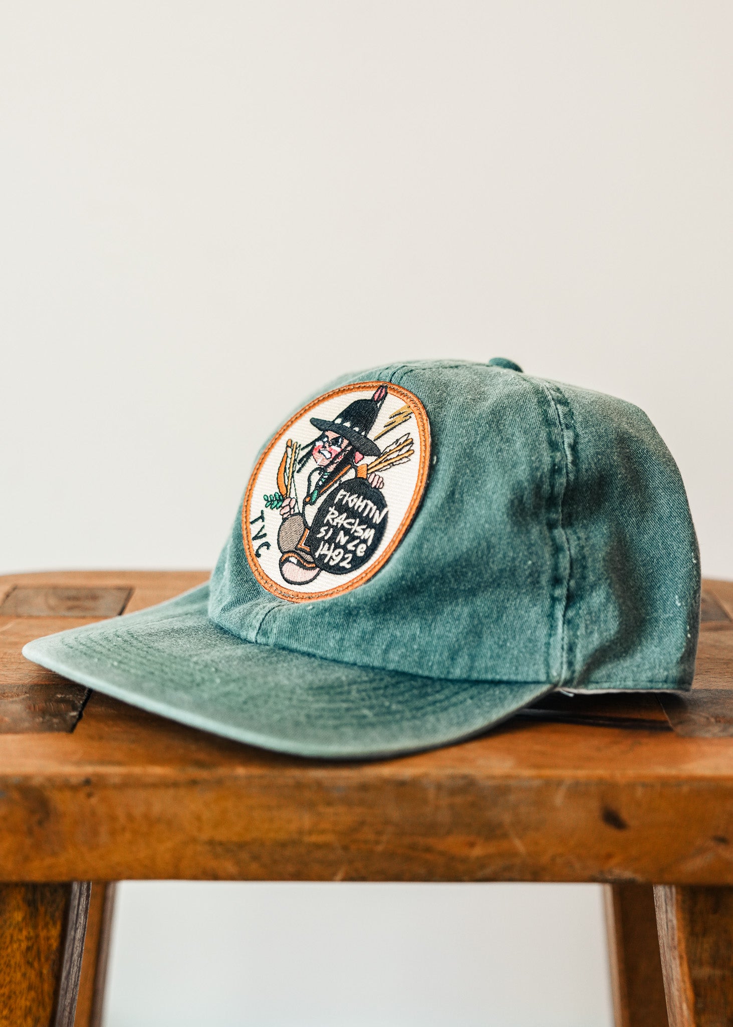 "Fightin Racism Since 1492" - Faded Green Cap